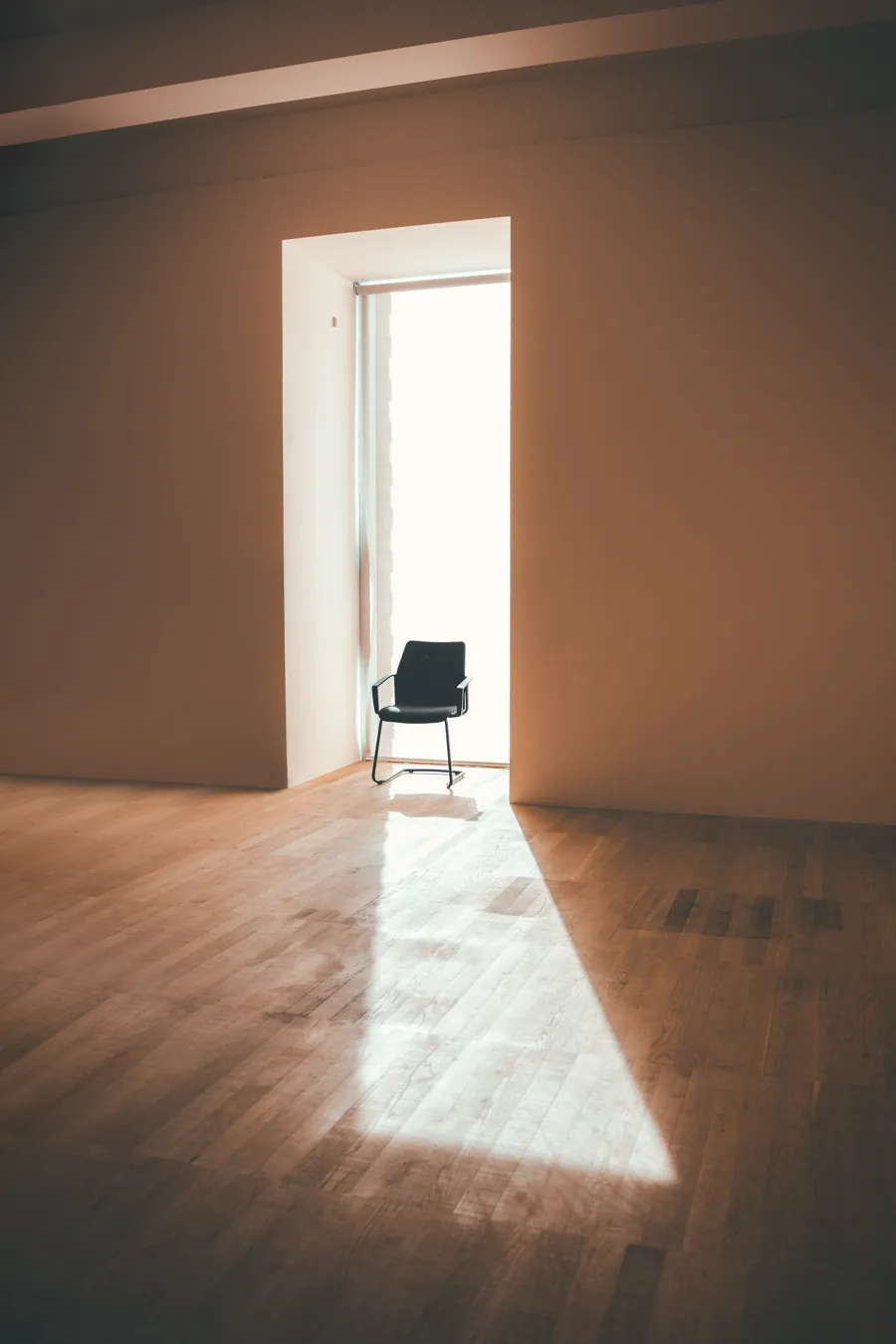 An empty chair in a sunlit room